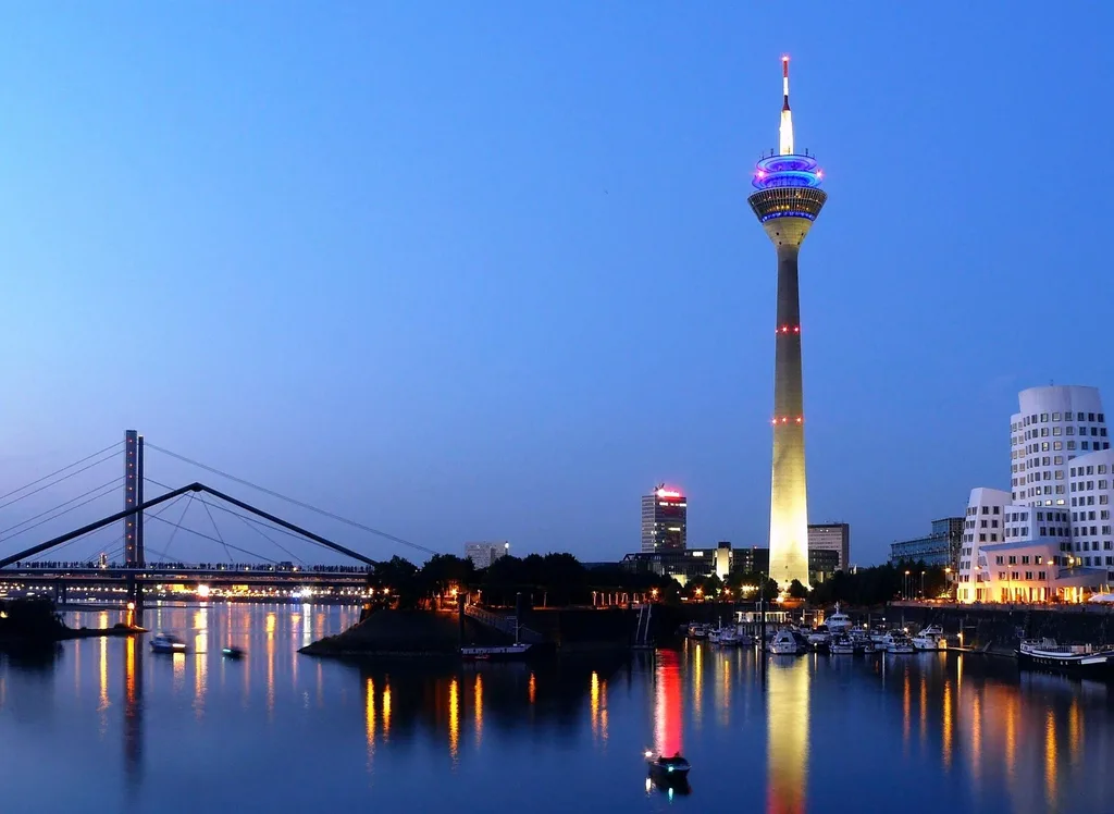 Düsseldorf skyline with the Rheinturm and Medienhafen on the Rhine at dusk