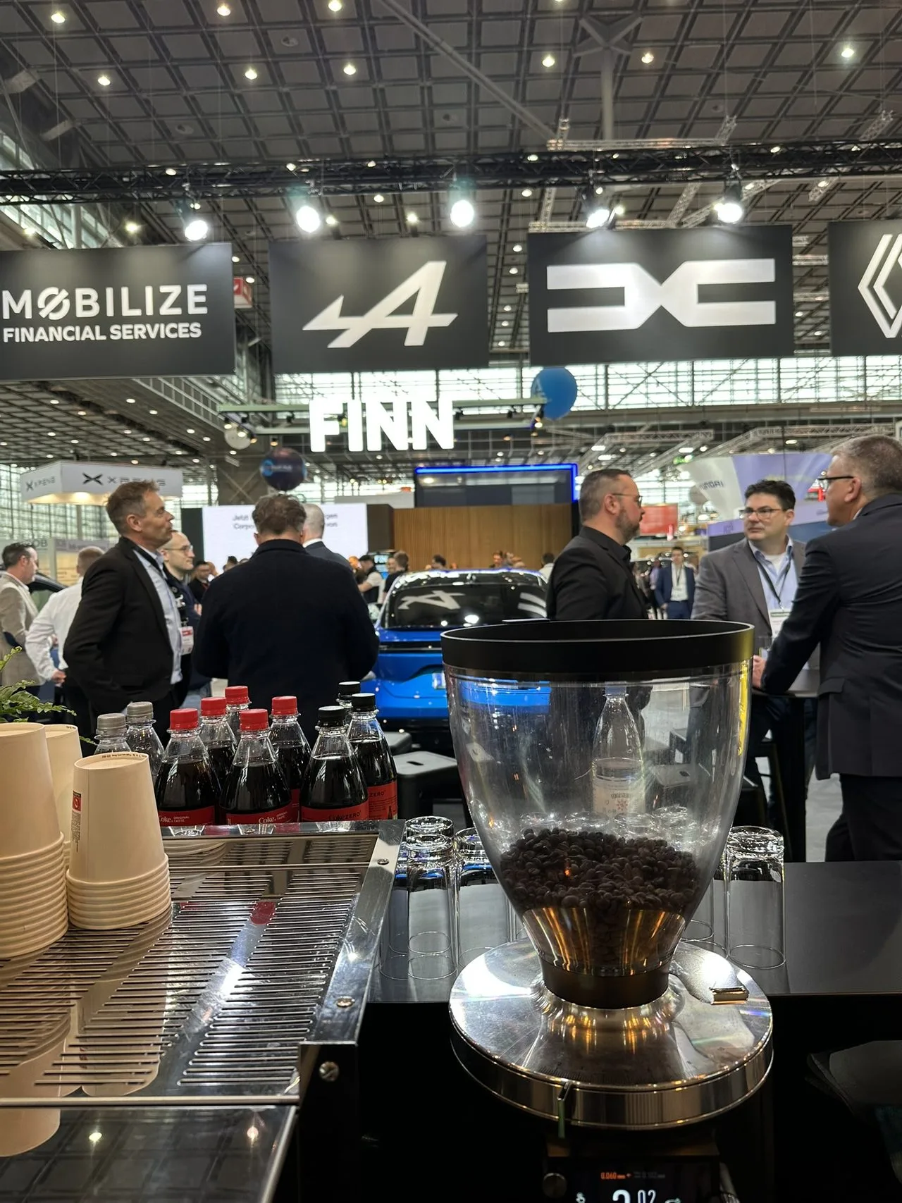 ExpoBaristi barista serving specialty coffee at a trade fair stand