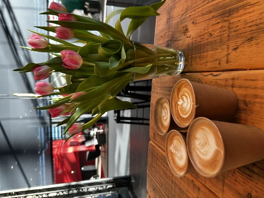 Branded latte art with a logo printed onto the coffee foam