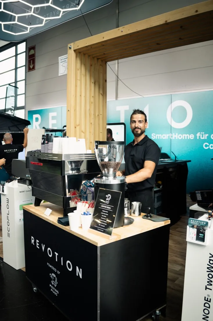 ExpoBaristi barista at a branded La Marzocco coffee bar at a trade fair