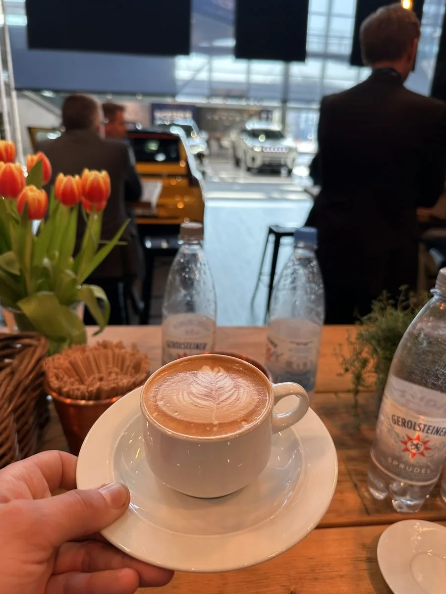 Cappuccino served to a visitor at a trade fair stand
